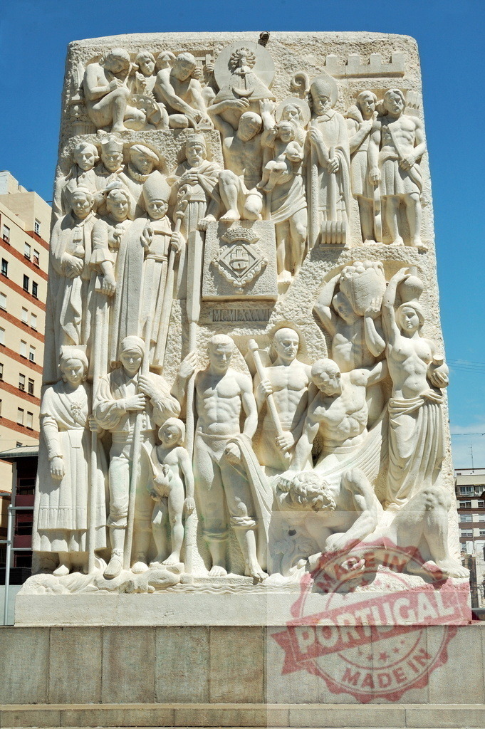 Monument depicting local history, culture, and religious figures | Stone carving monument representing community, tradition, and spiritual heritage under a clear sky - Realized with Pictrs.com