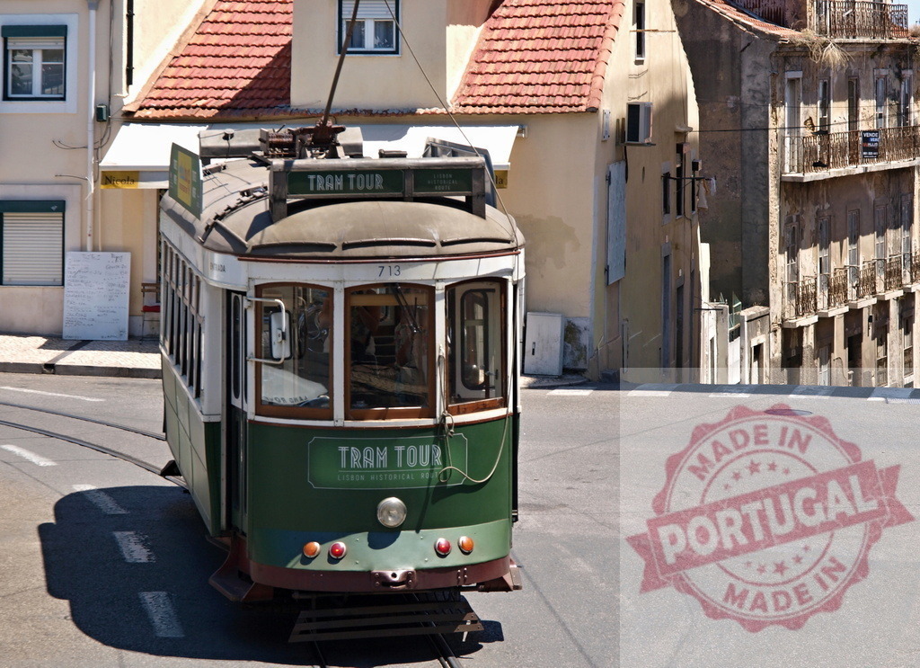 Vintage green tram turning in Lisbon, Portugal | Green and white vintage tram number 713 turning in Lisbon, Portugal - Realized with Pictrs.com