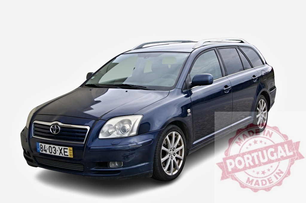 Toyota Avensis station wagon parked on white background | Dark blue Toyota Avensis parked on a white background, showcasing its sleek design and practicality - Realized with Pictrs.com