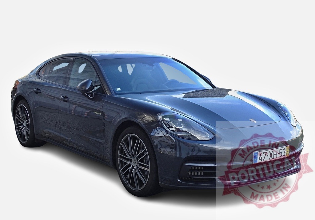 Porsche Panamera 4 e-hybrid showcasing its sleek design and luxurious features | Modern luxury sedan Porsche Panamera 4 e-hybrid parked and showcasing its sleek design, elegant lines, and advanced technology - Realized with Pictrs.com