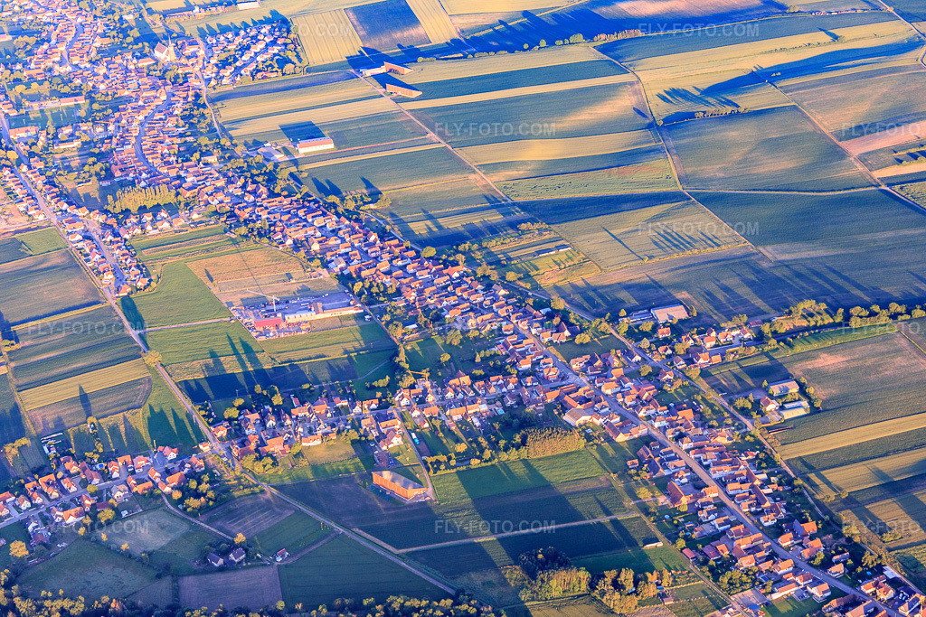 Aerial view: View of the town from the west in Schleithal in the state Bas-Rhin, France. – Photo: IMG_115552.jpg taken on 06/16/2019 by Werner Riehm/FLY-FOTO.com – Resolution of the original: 5472 x 3648 px