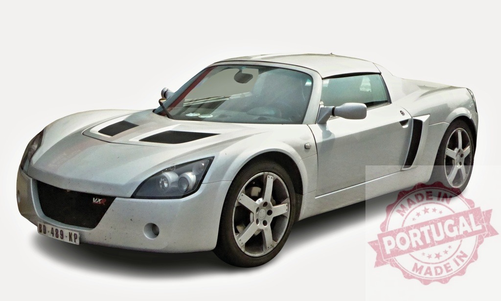 Silver Opel Speedster VX220 parking on white background | Stylish silver Opel Speedster VX220 sports car parked on a plain white background, showcasing its sleek design and sporty features - Realized with Pictrs.com