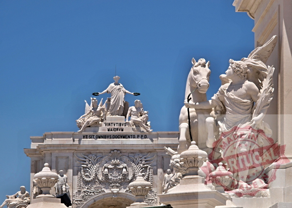 Arco da Rua Augusta monumental arch in Lisbon, Portugal. Lisbon - Portugal | Ornate sculptures decorating the historical Arco da Rua Augusta against a clear blue sky - Realized with Pictrs.com