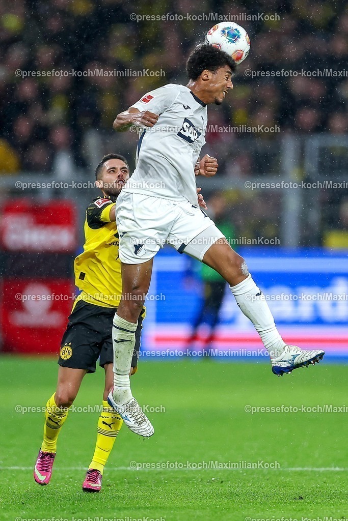 BVB07122501029 | 07.12.2025, Fußball, Borussia Dortmund - TSG 1899 Hoffenheimt, 1. Fußball Bundesliga, 13. Spieltag, Signal Iduna Park, Saison 2025 2026: Yan Couto&nbsp;(BVB #02) im Zweikampf gegen  Bernardo&nbsp;(TSG Hoffenheim #13) Kopfball  DFB regulations prohibit any use of photographs as image sequences and or quasi-video.