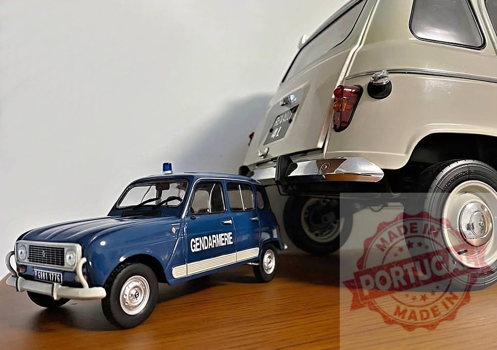 Renault 4 Gendarmerie scale model with vintage civilian car | Two classic Renault 4 toy cars on a wooden surface, showing different models - Realized with Pictrs.com