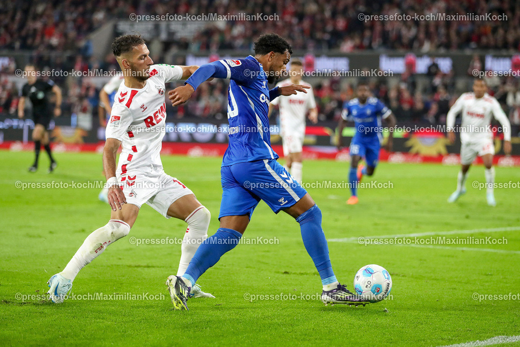 Koe14092401022 | 14.09.2024, 2. Fußball Bundesliga, 1. FC Köln - 1. FC Magdeburg, RheinEnergieSTADION, Saison 2024 2025: Zweikampf Dejan Ljubicic (1.FC Köln #7) gegen Xavier Amaechi (1.FC Magdeburg #20)DFB regulations prohibit any use of photographs as image sequences and or quasi-video.