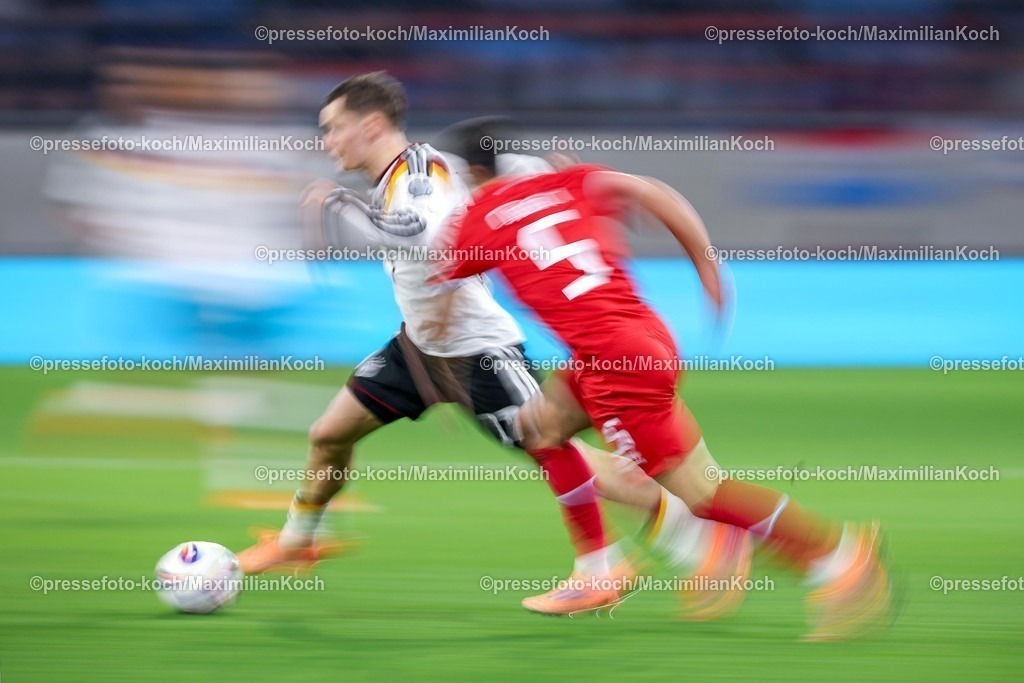 DFB14112501132 | 14.11.2025, Fußball, Länderspiel, WM-Qualifikation Europa, Deutschland - Luxemburg, Stade de Luxembourg (Croix de Gasperich, Luxemburg), 9. Spieltag, Saison 2025 2026: Dynamic Feature Florian Wirtz (GER #17) im Zweikampf gegen  Alessio Curci (LUX #05)  Regulations prohibit any use of photographs as image sequences and or quasi-video.