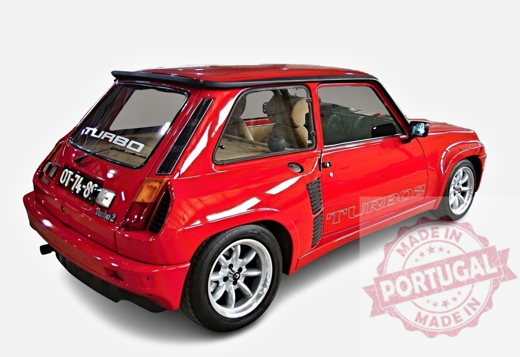 Red Renault 5 Turbo 2 showing its powerful rear side | Classic red Renault 5 Turbo 2 parked and showing its rear and side, with visible Turbo stickers, alloy wheels and spoiler - Realized with Pictrs.com