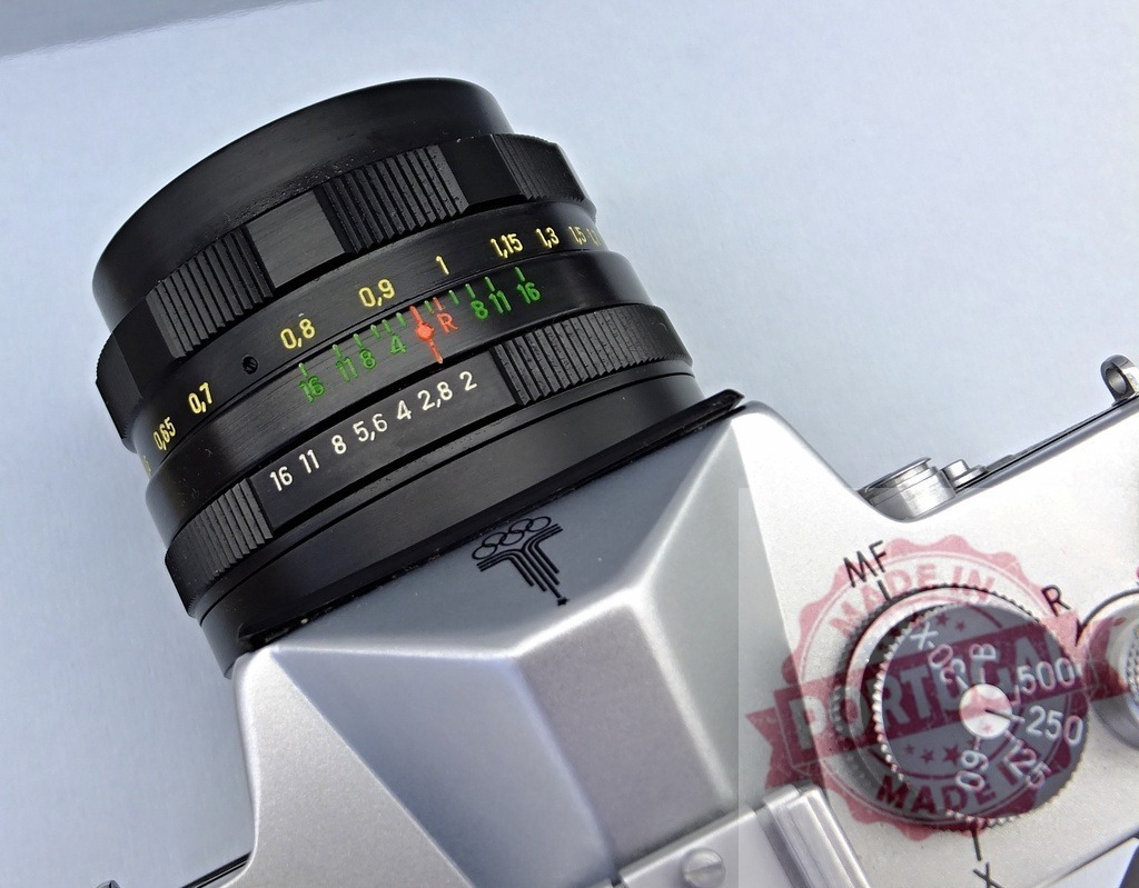 Zenit camera with Moscow Olympics symbol and lens detail | Vintage Zenit SLR camera featuring its lens and Moscow 1980 Olympics logo - Realized with Pictrs.com