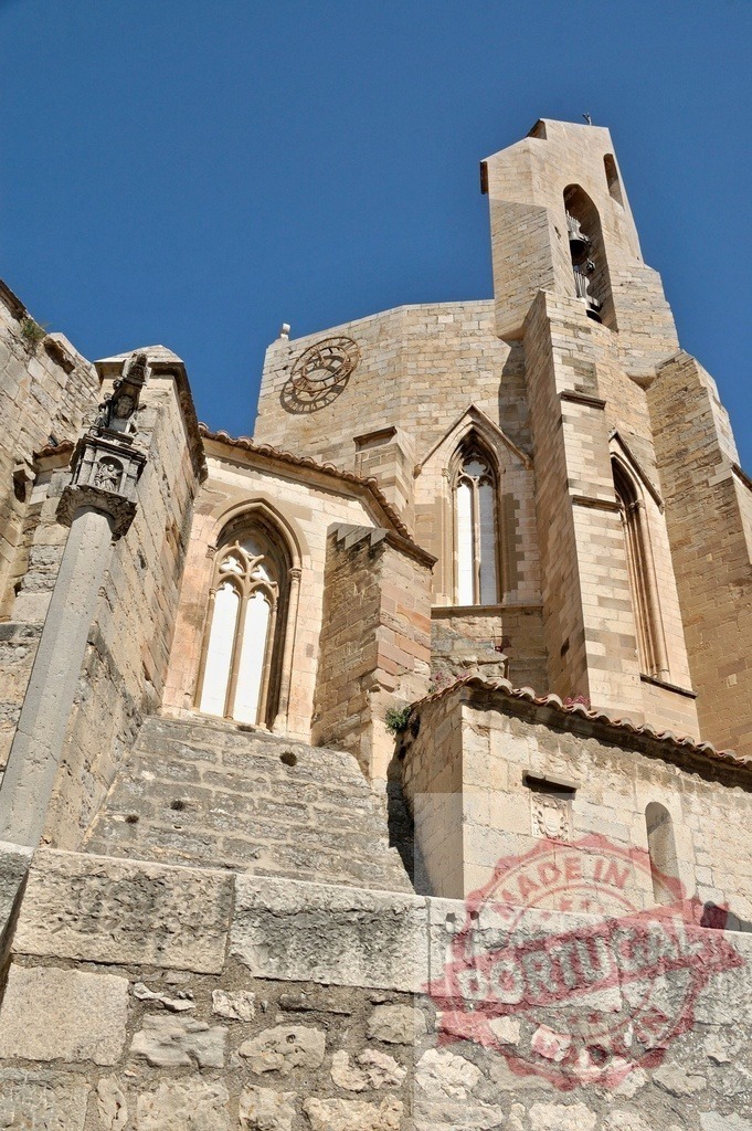 Morella archpriestal church of Santa María la Mayor facade | Gothic stone architecture with old lancet windows and bell tower under a clear sky - Realized with Pictrs.com