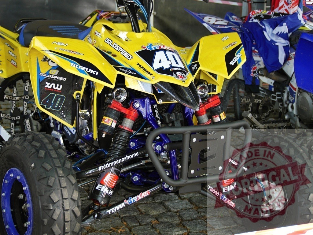 Suzuki Quad ATV Prepared for Off-Road Racing Competition | Customized Suzuki quad ATV waiting for the start of an off-road race - Realized with Pictrs.com