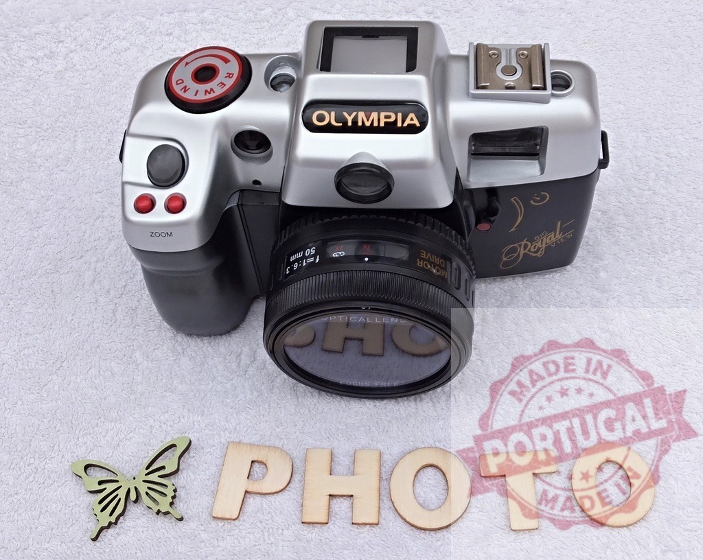 Olympia Royal vintage 35mm film camera for photography hobby | Olympia Royal film camera and wooden PHOTO letters reflecting passion for analog photography practice - Realized with Pictrs.com