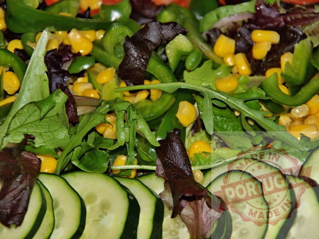 Preparing healthy fresh vegetable salad for balanced diet | Fresh mixed garden salad with cucumber slices, bell pepper, corn, and greens - Realized with Pictrs.com