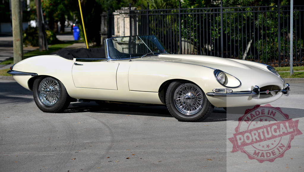 Classic white Jaguar E-Type roadster parked on a residential street | Gleaming white vintage Jaguar E-Type roadster parked on a quiet residential street, embodying timeless automotive elegance - Realized with Pictrs.com