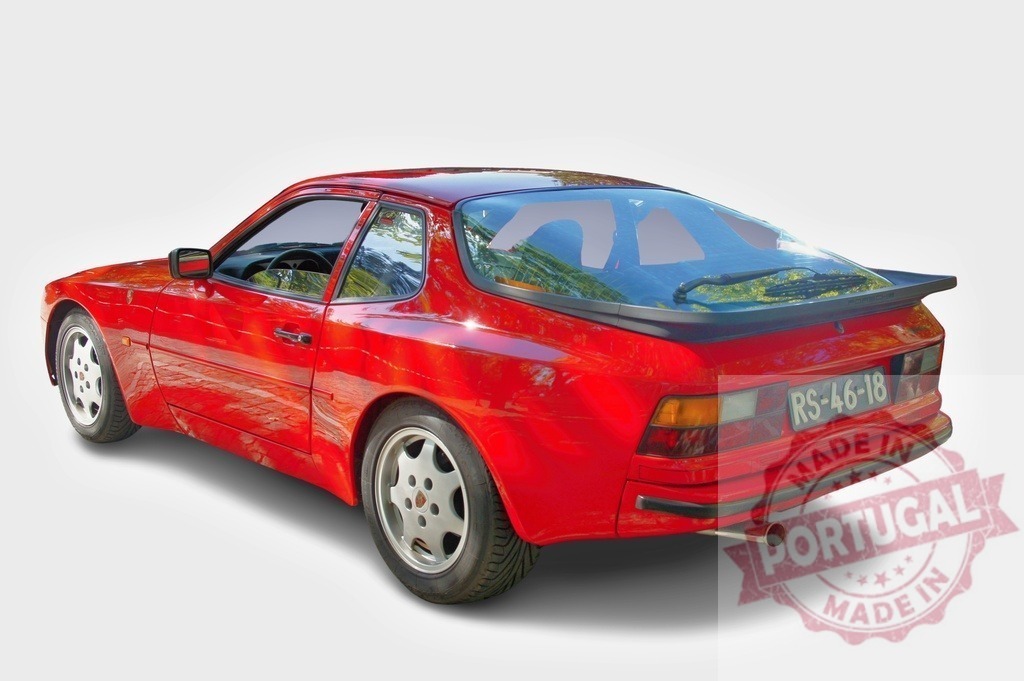 Red Porsche 944 Turbo parked showing rear side view | Classic red Porsche 944 Turbo parked on white background showing rear side view - Realized with Pictrs.com
