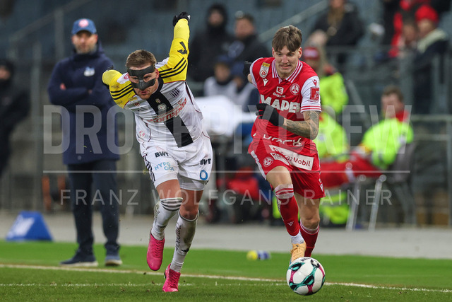 Austrian Bundesliga: Grazer AK 1902 vs LASK | GRAZ, AUSTRIA, 13.DEC.25 - SOCCER - ADMIRAL Bundesliga, Grazer AK 1902 vs LASK. The image shows Kasper Jörgensen (Lask) and Tio Cipot (GAK).