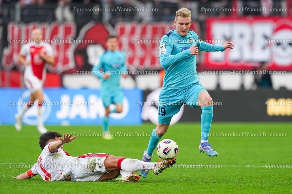 xYDRx18102501120 | 18.10.2025, xydrx, Fußball, 3.Liga, Rot-Weiss Essen - FC Viktoria Köln, Saison 2025 2026, Stadion an der Hafenstraße:  Ahmet Arslan (Rot-Weiss Essen #6) im Zweikampf gegen Meiko Sponsel (FC Viktoria Köln #19)     DFB regulations prohibit any use of photographs as image sequences and or quasi-video.