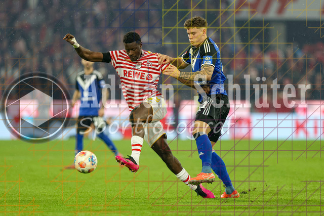 1. FC Köln vs Hamburger SV - 1. Bundesliga  | Köln, Deutschland, 02.11.25:   Ragnar Ache (1. FC Köln) und Nicolai Remberg (Hamburger SV) im Kampf um den Ball waehrend des Spiels der Bundesliga zwischen  1. FC Köln vs Hamburger SV in der RheinEnergieStadion(Foto von Brauer-Fotoagentur / Adrian Schlueter)