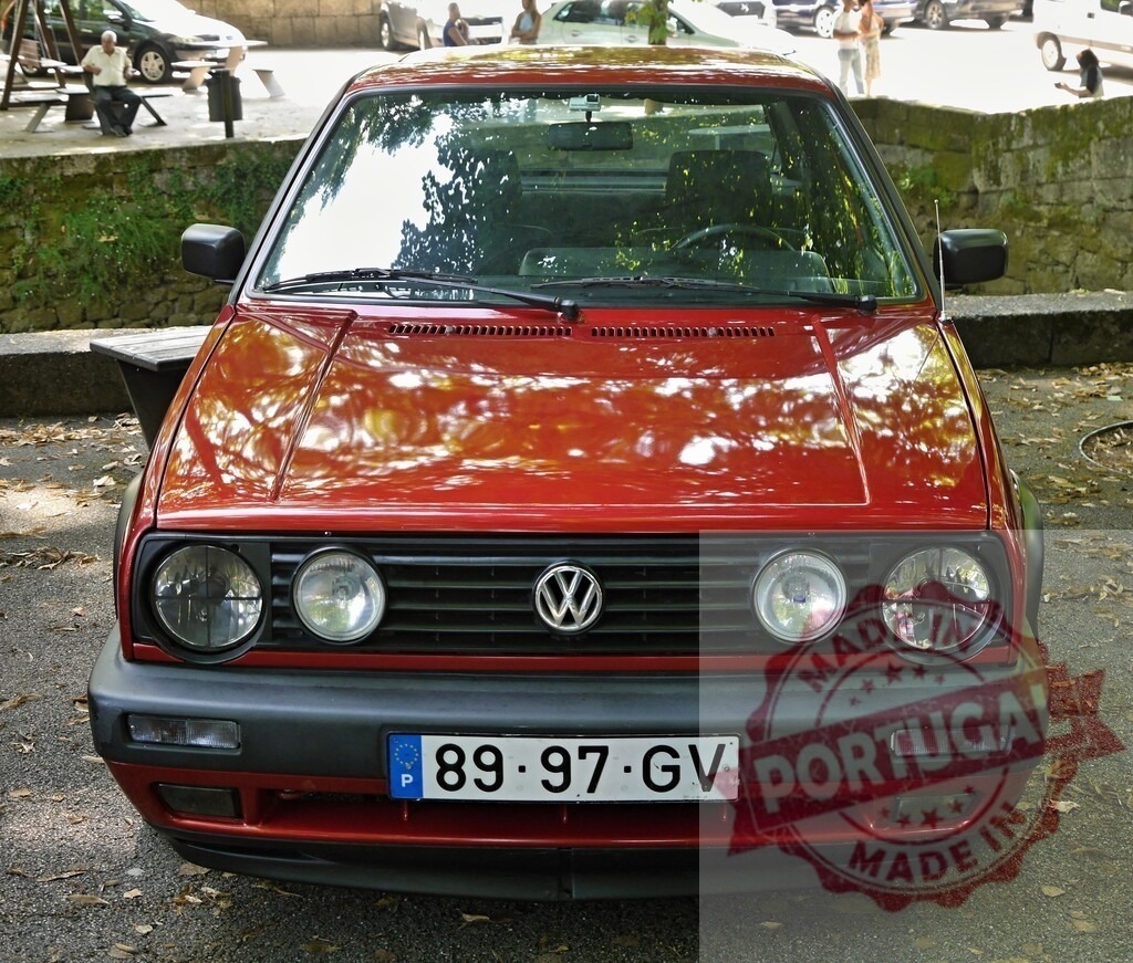Volkswagen Golf Mk2 red hatchback parked on a sunny day | Volkswagen Golf Mk2 red car vintage automobile front view - Realized with Pictrs.com