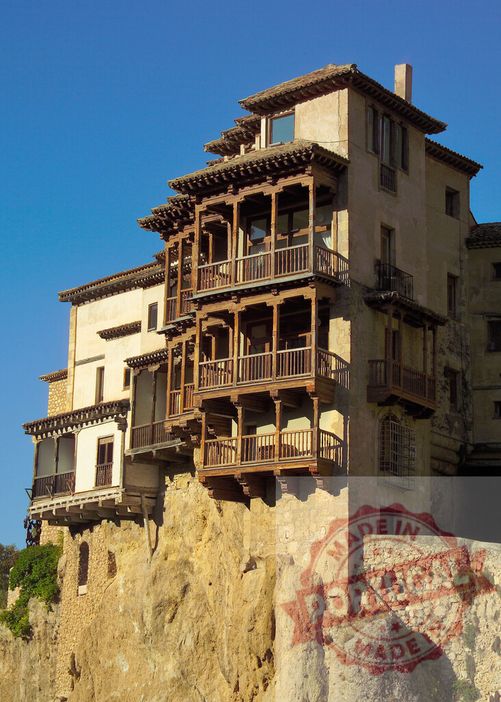 Cuenca Hanging Houses Casas Colgadas over cliff architecture. Cuenca - Spain | Historic Casas Colgadas balancing on a cliff edge with traditional wooden balconies - Realized with Pictrs.com