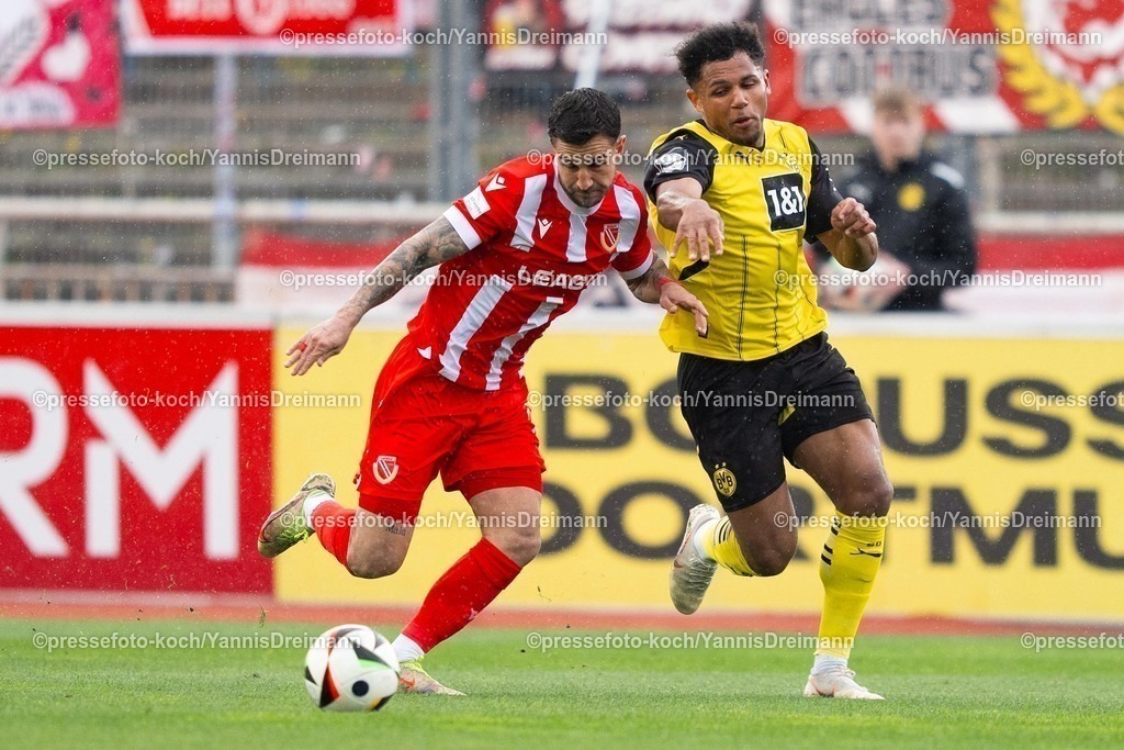 xydr13042501013 | 13.04.2025, xydrx, Fußball, Borussia Dortmund II - FC Energie Cottbus, 3.Liga, Stadion Rote Erde, Saison 2024 2025: Filip Kusic (FC Energie Cottbus #19) im Zweikampf gegen  Paul-Philipp Besong (Borussia Dortmund II #7) DFB regulations prohibit any use of photographs as image sequences and or quasi-video.