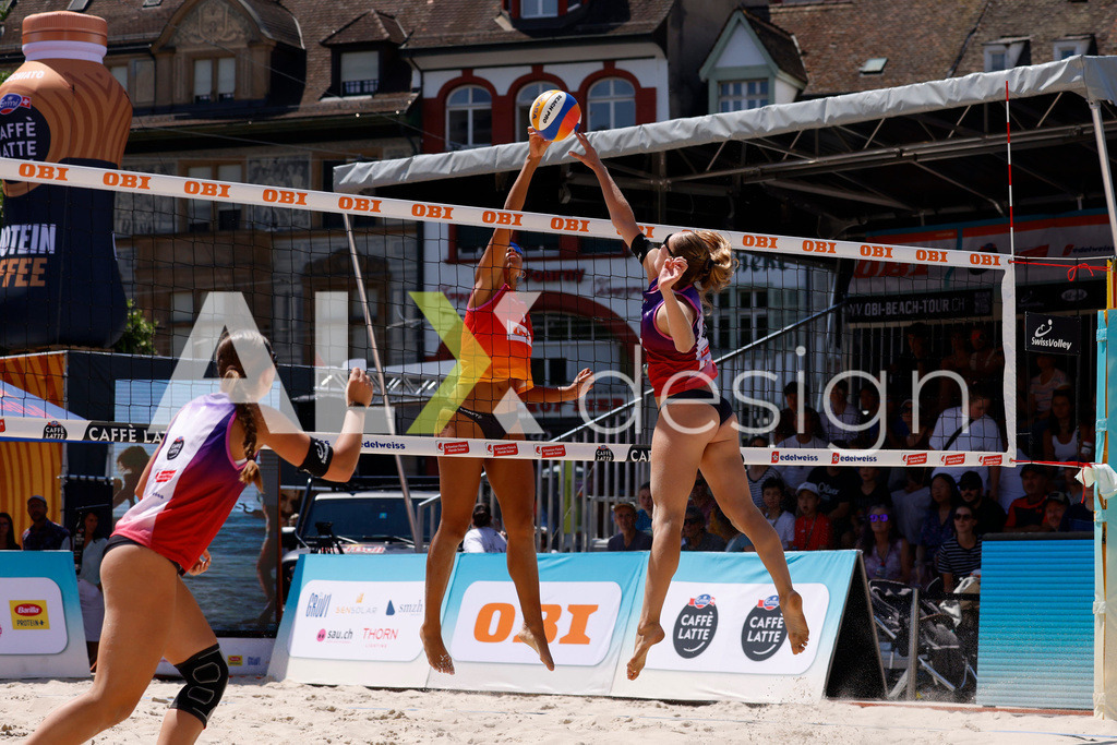 Obi BeachTour 2026 - Basel | BASEL, SWITZERLAND - JULY 18: LIVIA STOLZ (SUI) and ELENA CSONTOS (SUI) attack / spike during the Obi BeachTour 2026 match between CSONTOS / DEECKE (SUI) and WANDELER / STOLZ (SUI) at Barfüsserplatz on July 18, 2026 in Basel, Switzerland. - Realisiert mit Pictrs.com