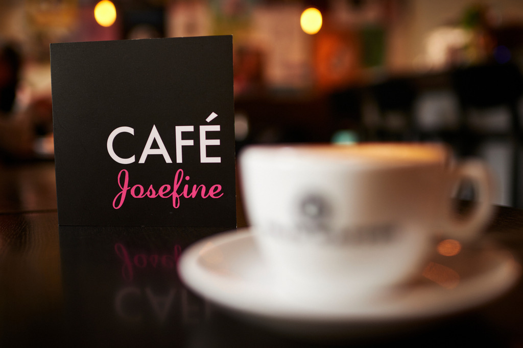 Cafe Josefine | WIen, Austria - February 13, 2018: Cafe Josefine; auf dem Tisch stehend eine Speisekarte und eine Tasse Felix Kaffe (Melange). - Realisiert mit Pictrs.com