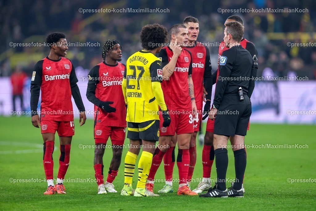 BVB10012501087 | 10.01.2025, Fußball, Borussia Dortmund - Bayer 04 Leverkusen, 1. Fußball Bundesliga, 16. Spieltag, Signal Iduna Park, Saison 2024 2025: Rudelbildung zum Ende der ersten Halbzeit um Schiedsrichter Tobias StielerDFB regulations prohibit any use of photographs as image sequences and or quasi-video.