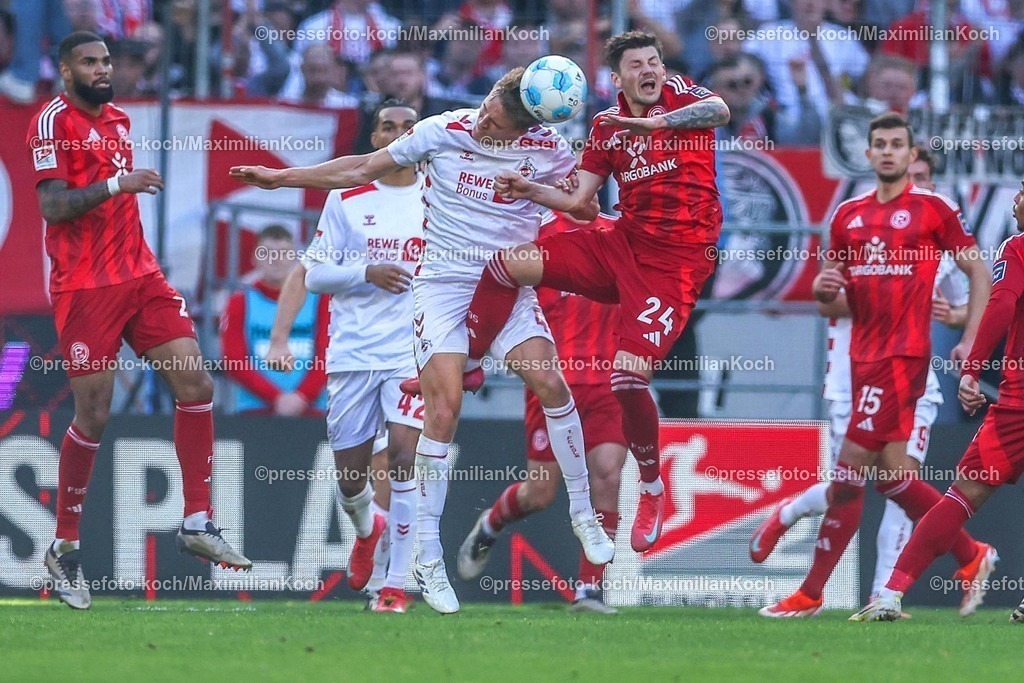 1FC23022501039 | 23.02.2025, Fußball, 1. FC Köln - Fortuna Düsseldorf, 2.. Fußball Bundesliga, 23. Spieltag, RheinEnergie-STADION, Saison 2024 2025: Timo Hübers (FC Köln #4) im Zweikampf gegen Isak Johannesson (Fortuna Düsseldorf #8)DFB regulations prohibit any use of photographs as image sequences and or quasi-video.