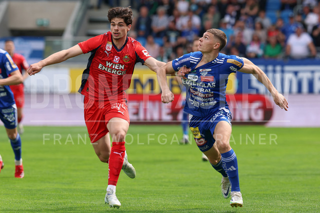 TSV Egger Glas Hartberg vs SK Rapid Wien – Championship Group    | Hartberg, Austria, 19.Apr.26 - SOCCER - ADMIRAL Bundesliga, TSV Egger Glas Hartberg vs SK Rapid Wien. The image shows Jakob Schoeller (SK Rapid Wien) and Elias Havel (Hartberg). 