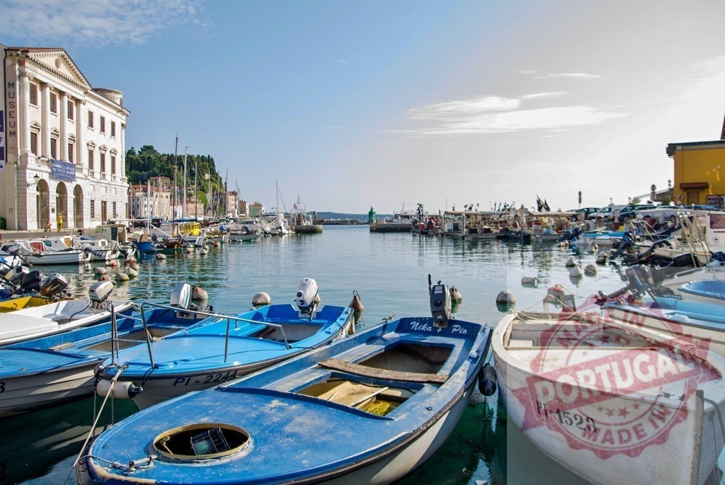 Colorful fishing boats mooring in the harbor of Piran, Slovenia | Fishing boats moored in the harbor of Piran, a resort town on the Slovenian Riviera, with the museum in the background - Realized with Pictrs.com