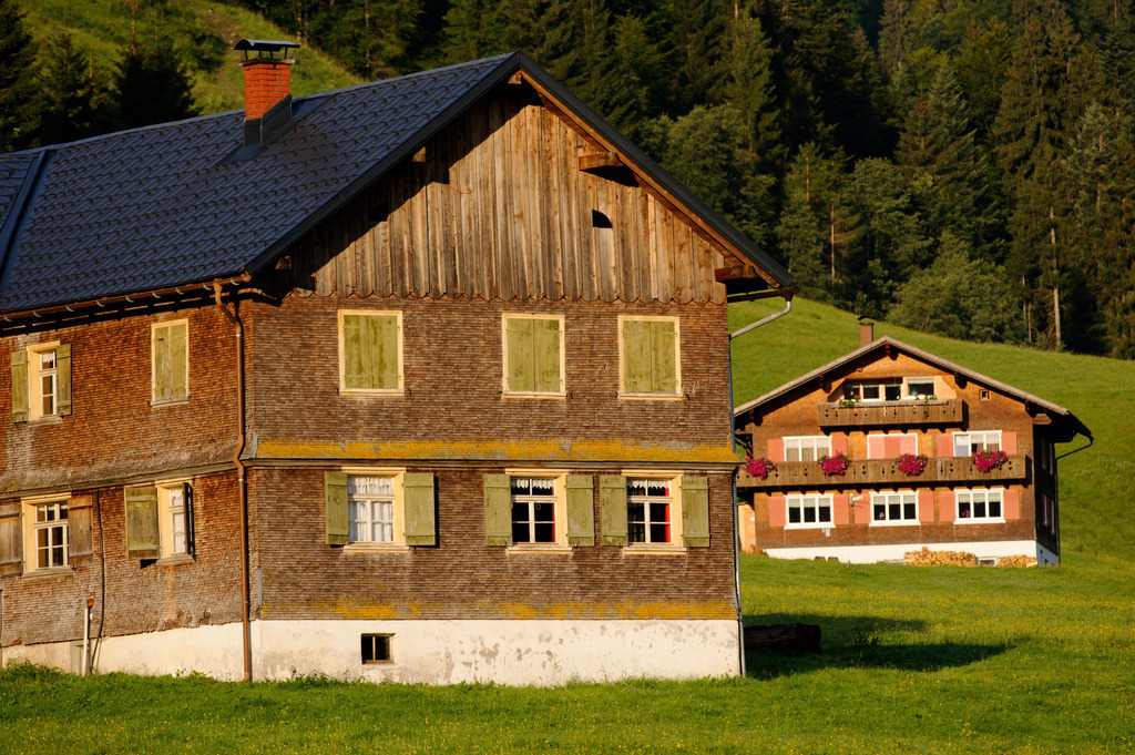 Bregenzerwälderhaus | Schoenenbach, Austria - July 24, 2012: Vorsäßsiedlung Schönenbach;  geschindeltes Bregenzerwälderhaus im Morgenlicht. - Realisiert mit Pictrs.com