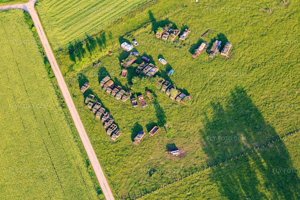 Aerial view: Decommissioned military trucks in a meadow in Vibersviller in the state Moselle, France. – Photo: IMG_107402.jpg taken on 05/19/2018 by Werner Riehm/FLY-FOTO.com – Resolution of the original: 5472 x 3648 px
