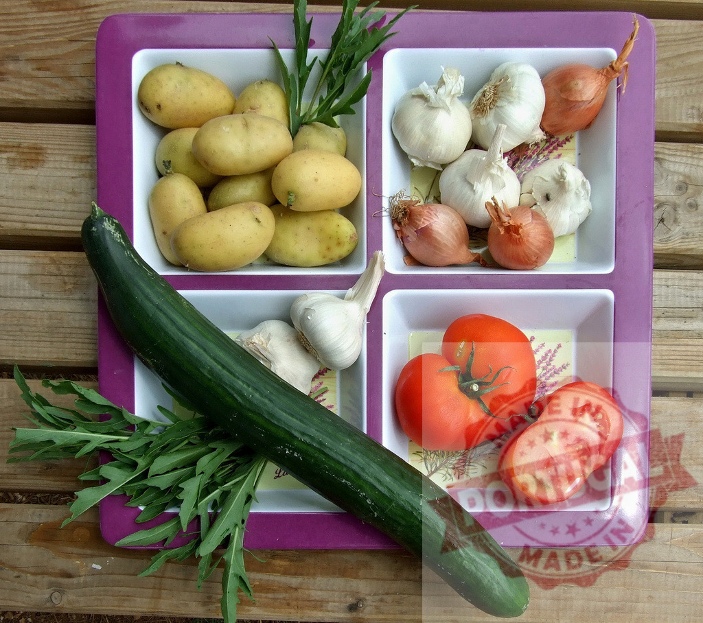 Fresh garden vegetables on a serving tray | Variety of fresh vegetables and herbs presenting a healthy harvest on a tray - Realized with Pictrs.com