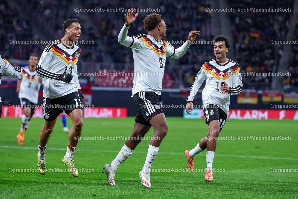 DFB17112503065 | 17.11.2025, Fußball, Länderspiel, WM-Qualifikation Europa, Deutschland - Slowakei, Red Bull Arena (Leipzig), 10. Spieltag, Saison 2025 2026: Torjubel nach dem Tor zum 6:0 durch Torschütze Forzan Assan Ouedraogo (GER #09)  zusammen mit Felix Nmecha (GER #13) Nathaniel Brown (GER #18)   Regulations prohibit any use of photographs as image sequences and or quasi-video.