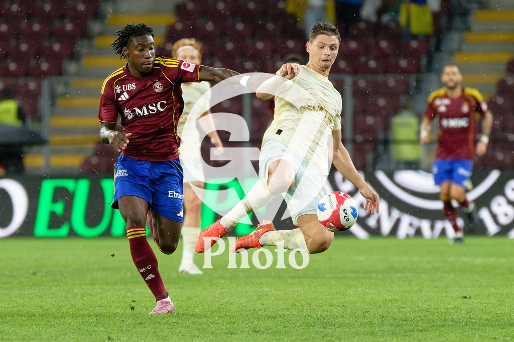 UEFA Conference League Play-offs 2nd leg - Servette FC v FC Shakhtar Donetsk | Valeriy Bondar (5 FC Shakhtar Donetsk) Tiemoko Ouattara (17 Servette FC) battle for the ball (duel)  during the UEFA Conference League Play-offs 2nd leg match between Servette FC and FC Shakhtar Donetsk at Stade de Geneve in Geneva, Switzerland