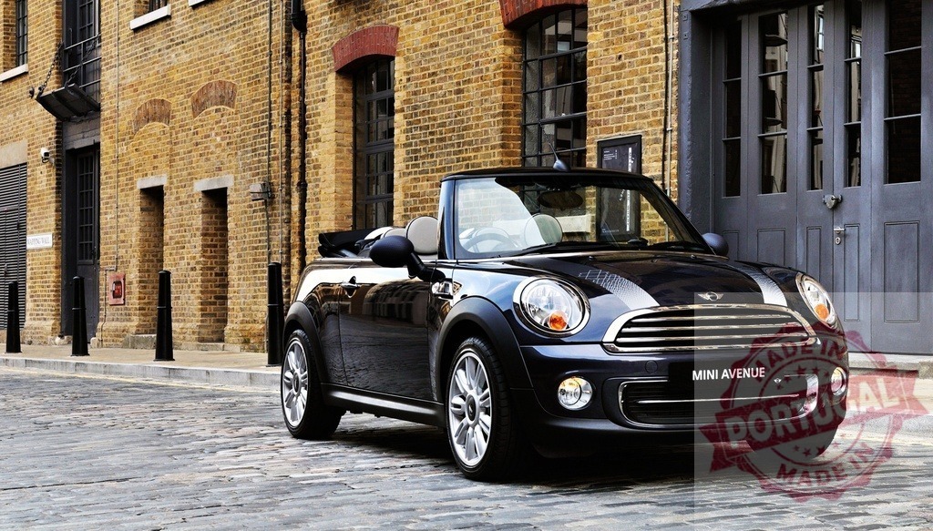 Mini Avenue convertible parked on a cobblestone street in London | Stylish Mini Avenue convertible parked near a brick building on a London cobblestone street - Realized with Pictrs.com