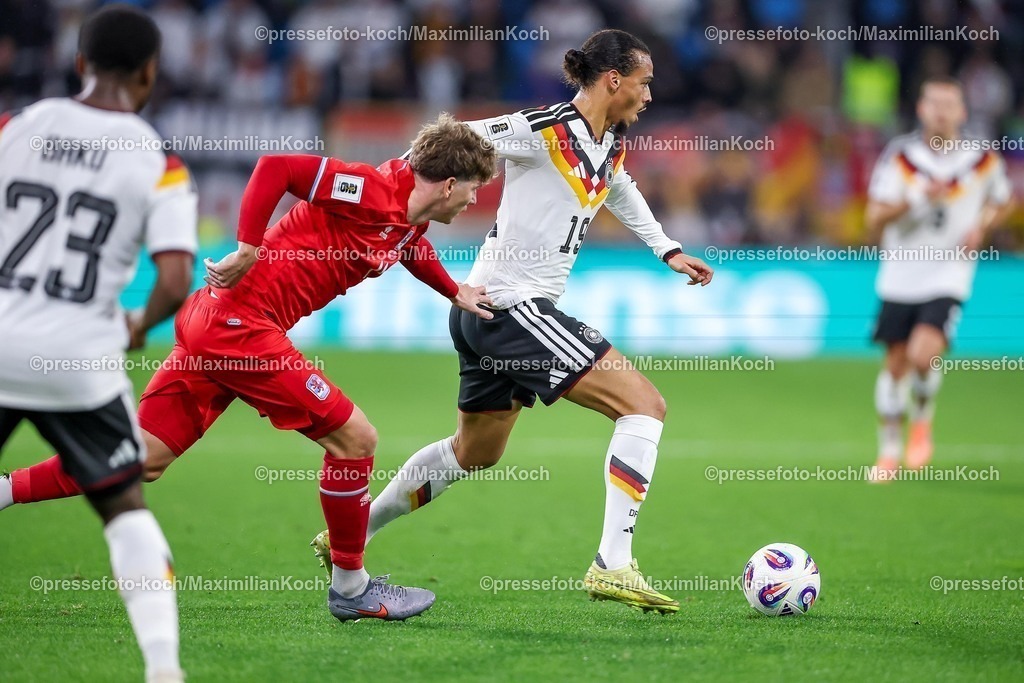 DFB14112501087 | 14.11.2025, Fußball, Länderspiel, WM-Qualifikation Europa, Deutschland - Luxemburg, Stade de Luxembourg (Croix de Gasperich, Luxemburg), 9. Spieltag, Saison 2025 2026: Florian Bohnert (LUX #04) im Zweikampf gegen  Leroy Sane (GER #19)  Regulations prohibit any use of photographs as image sequences and or quasi-video.