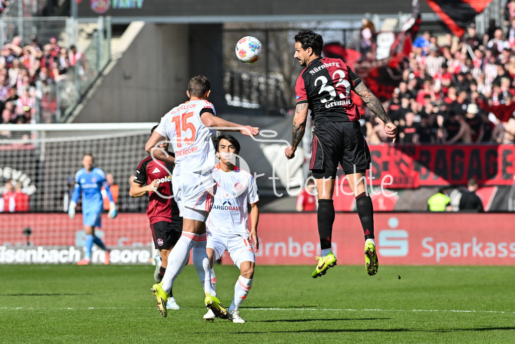 1. FC Nürnberg - Fortuna Düsseldorf | NUREMBERG, GERMANY - 07. MARCH:  im Duell Tim OBERDORF (Fortuna Düsseldorf 15) und Adriano GRIMALDI (1. FC Nuremberg 33) während dem Match zwischen dem 1. FC Nürnberg und Fortuna Düsseldorf am 25. Spieltag der 2. Bundesliga im Max Morlock Stadion / DFL REGULATIONS PROHIBIT ANY USE OF PHOTOGRAPHS AS IMAGE SEQUENCES AND/OR QUASI-VIDEO
