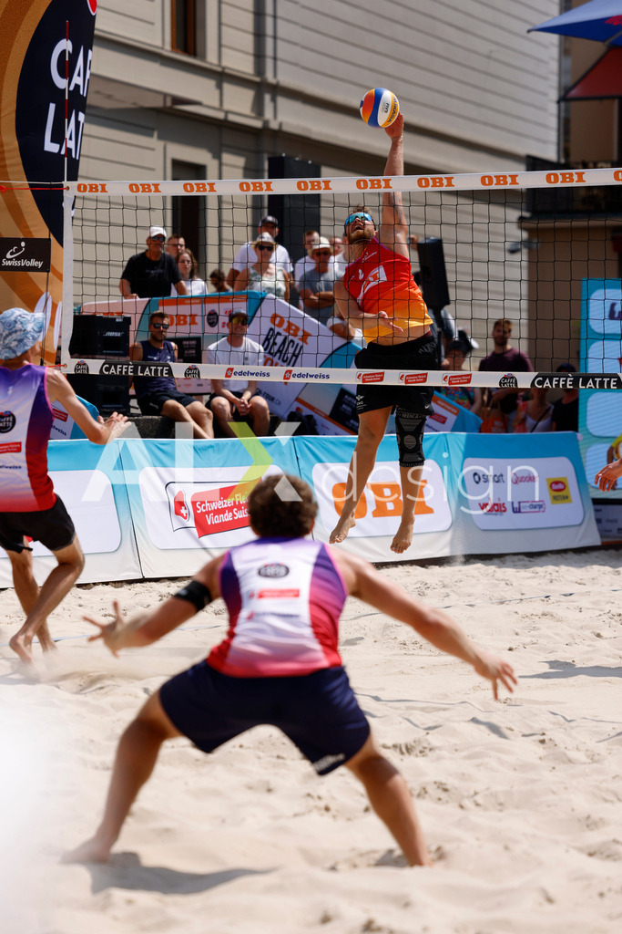 Obi BeachTour 2026 - Basel | BASEL, SWITZERLAND - JULY 19: MORITZ KINDL (AUT) attack / spike during the Obi BeachTour 2026 match between HAGENBUCH / HAUSSENER (SUI) and LEITNER / KINDL (AUT) at Barfüsserplatz on July 19, 2026 in Basel, Switzerland. - Realisiert mit Pictrs.com