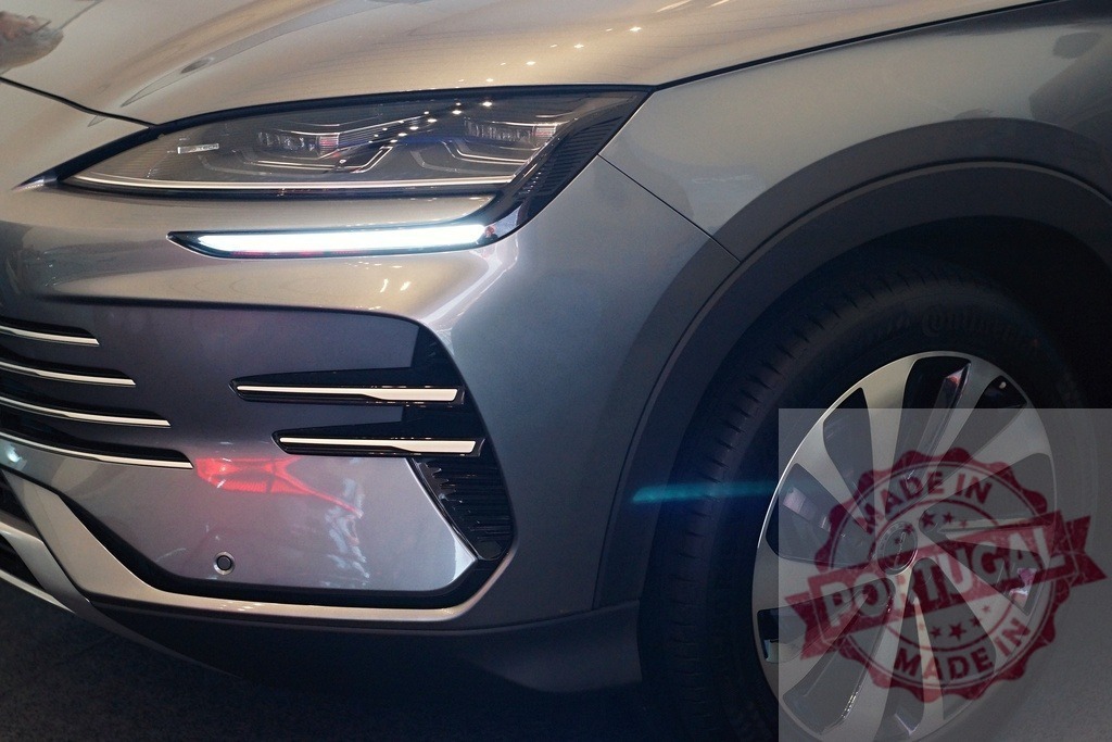 Audi Q6 e-tron electric SUV automotive design | Audi Q6 e-tron showcasing modern electric vehicle headlight and wheel design - Realized with Pictrs.com