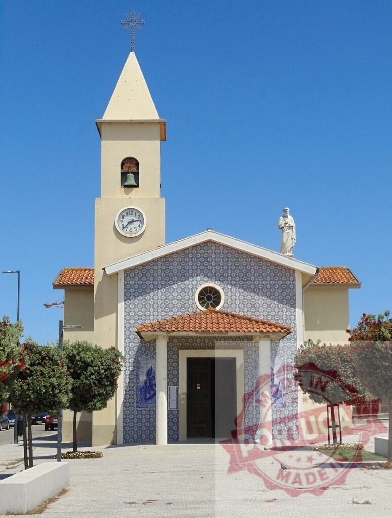 Portuguese church bell tower with traditional azulejo tiles. Aveiro - Portugal | Portugal church facade featuring a bell tower, clock, and azulejo tile patterns under a clear sky - Realized with Pictrs.com