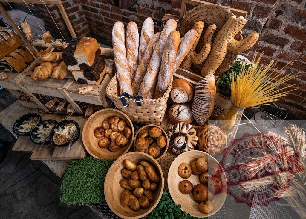 Rustic bakery display showcasing a variety of fresh bread and pastries | Bakery display with different types of bread, pastries, and pasta in a rustic setting - Realisiert mit Pictrs.com