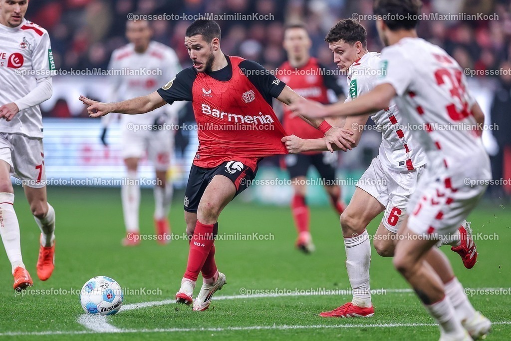 DFB05022501069 | 05.02.2025, Fußball, DFB-Pokal Viertelfinale, Bayer 04 Leverkusen - 1.FC Köln, BayArena, Saison 2024 2025: Emiliano Buendia Stati (Bayer04 Leverkusen #16) gegen Eric Martel (FC Köln #6)  im ZweikampfDFB regulations prohibit any use of photographs as image sequences and or quasi-video.