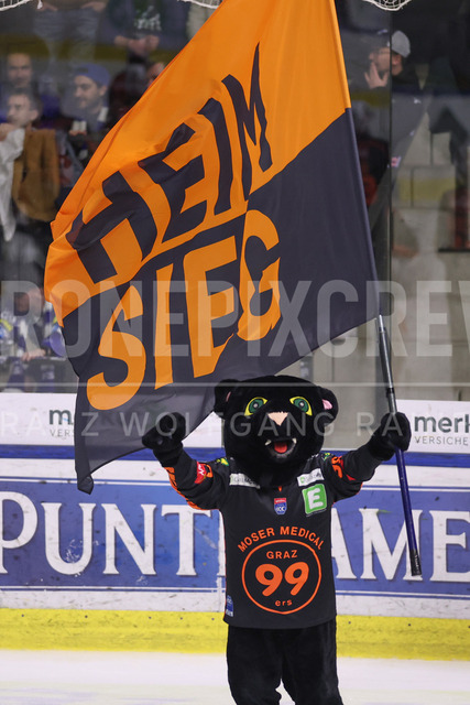 Moser Medical Graz 99ers vs EC iDM Wärmepumpen VSV – Ice Hockey    | Graz, Austria, 27.FEB.26 - ICE HOCKEY - ICE Hockey League, Graz 99ers vs Villacher SV. The image shows Pucky with flag home victory.     