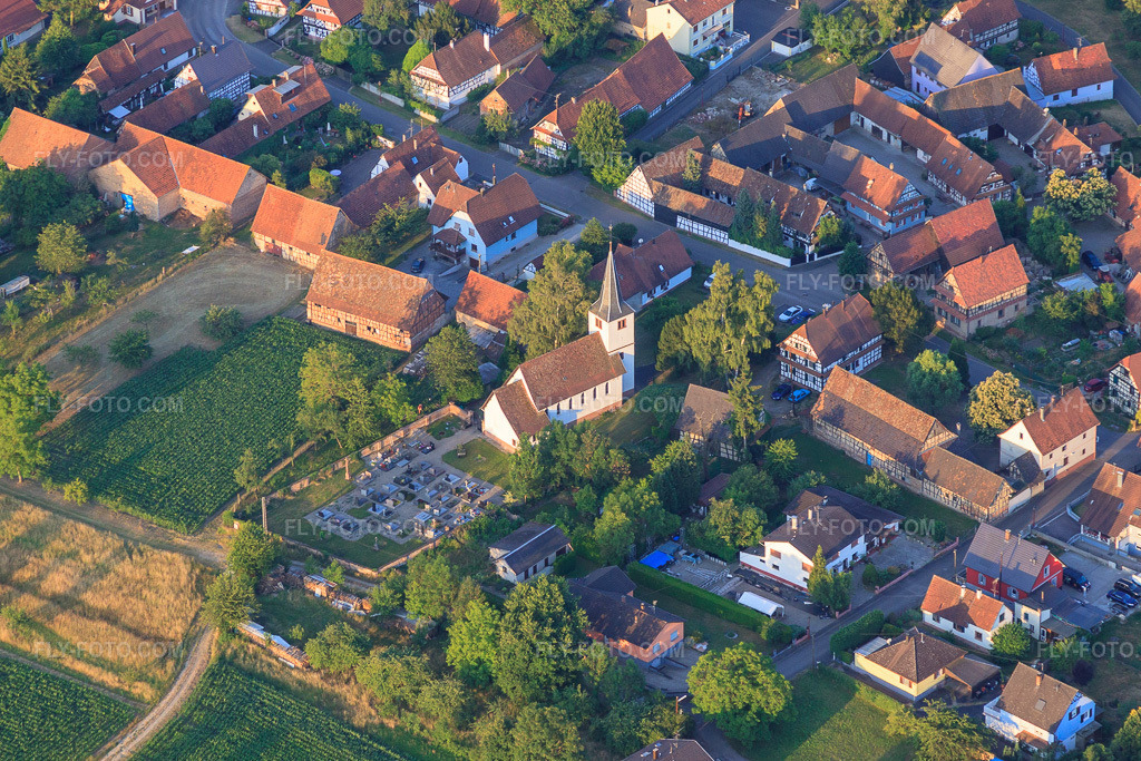 Aerial view: Cemetery and Protestant/Catholic Church of St. John in Kauffenheim in the state Bas-Rhin, France.Photo: IMG_67999.jpg taken on 06/19/2014 by Werner Riehm/FLY-FOTO.comResolution of the original: 4383 x 2922 px