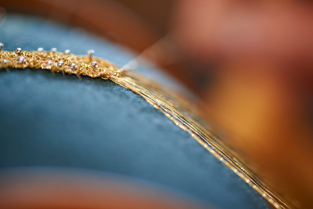 Erzeugung von Schmuckbaender aus Goldfaeden | Andelsbuch, Austria - May 27, 2016: Steurer Katharina; Erzeugung von Schmuckbaender aus Goldfaeden-Keadara. - Realisiert mit Pictrs.com