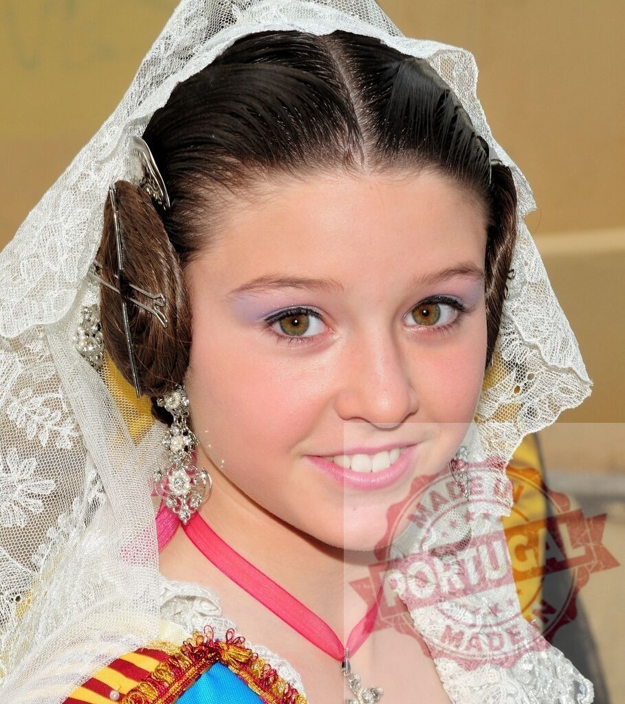 Young fallera wearing traditional costume during Las Fallas | Young girl in traditional Fallera dress smiling during the Las Fallas festival in Valencia - Realisiert mit Pictrs.com