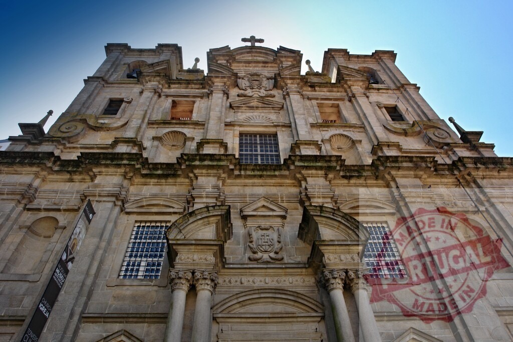Igreja de São Lourenço facade in Porto Portugal. Porto - Portugal | Ornate Mannerist and Baroque stone facade of the historic Church of Grilos against a blue sky - Realized with Pictrs.com