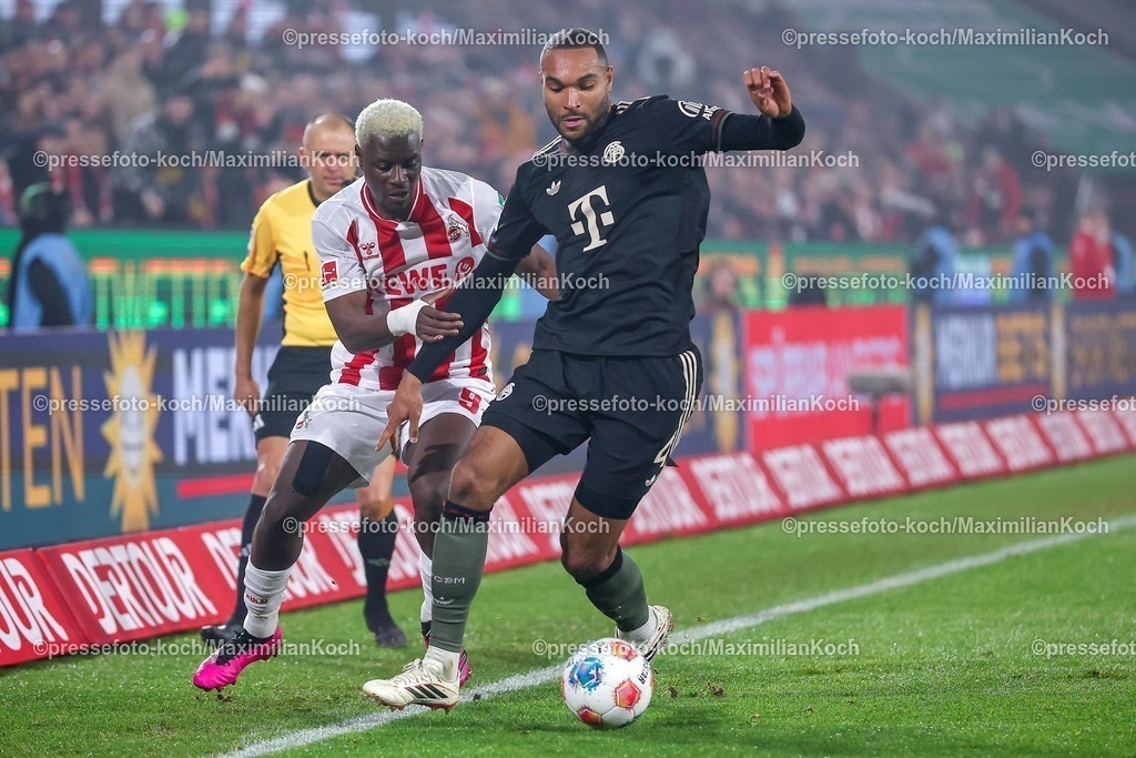 1FC14012601040 | 14.01.2026, Fußball, 1. FC Köln - FC Bayern München, 1. Fußball Bundesliga, 17. Spieltag, RheinEnergie-STADION, Saison 2025 2026: Ragnar Ache (1FC Koeln #09) im Zweikampf gegen  Jonathan Tah (FC Bayern Muenchen #04)  DFB regulations prohibit any use of photographs as image sequences and or quasi-video.